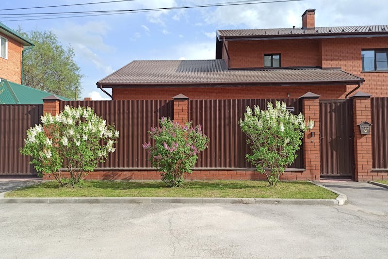 a house surrounded by a fence